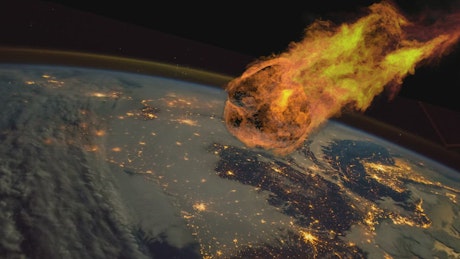 Large fiery meteor plummets towards a waiting Earth.
