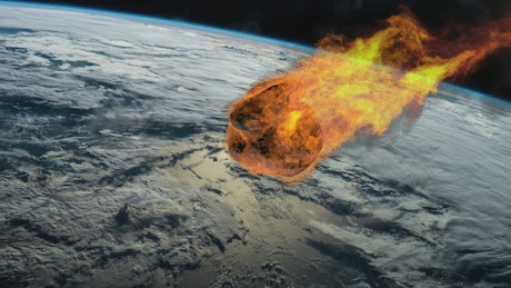 Large meteor on fire hurtles towards Earth.