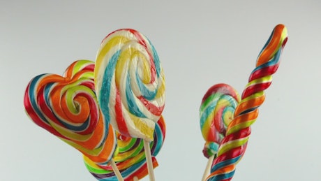 large rainbow swirl lollipops.