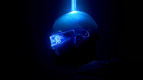 Laser lights span over head of a cyberpunk dancer.