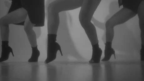 Legs of three girls dancing a choreography