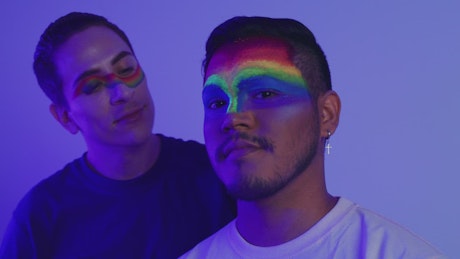 LGBT couple of men with rainbow makeup