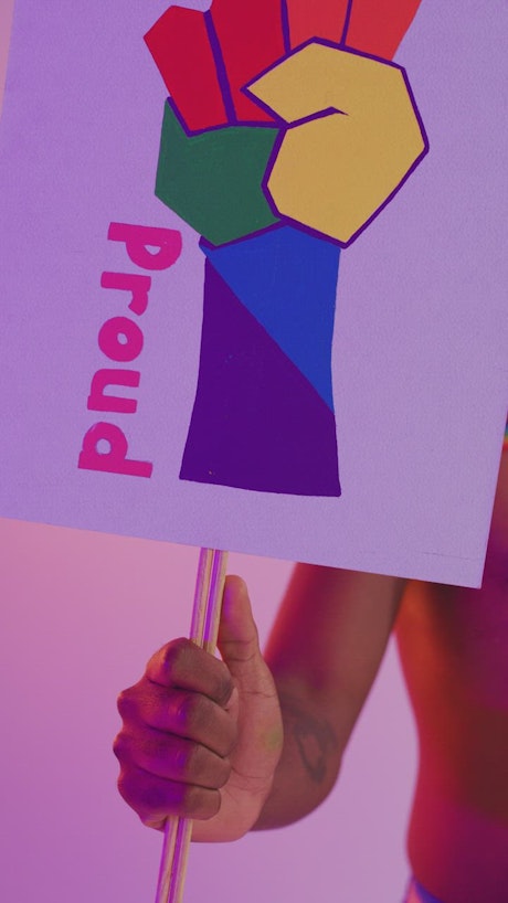 LGBT man with a pride sign.