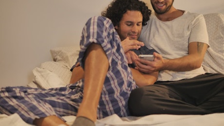 LGBTQ men sharing a moment before bed