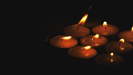 Lighting candles in the dark