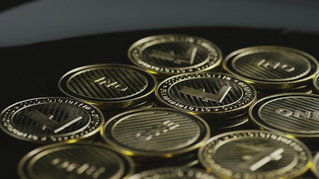 Lite cryptocurrency coins rotating.
