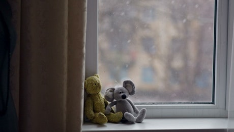 Little toys in the window in winter.