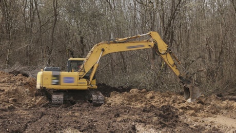 Loader in action digging soil.