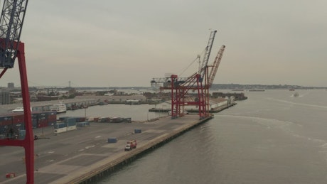Loading port with cranes, containers and ships.