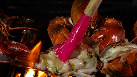 Lobster fired over hot coals