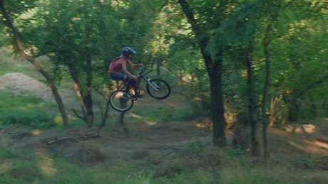Long jump in the bicycle on a rural road.