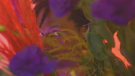 Look of a man through flowers