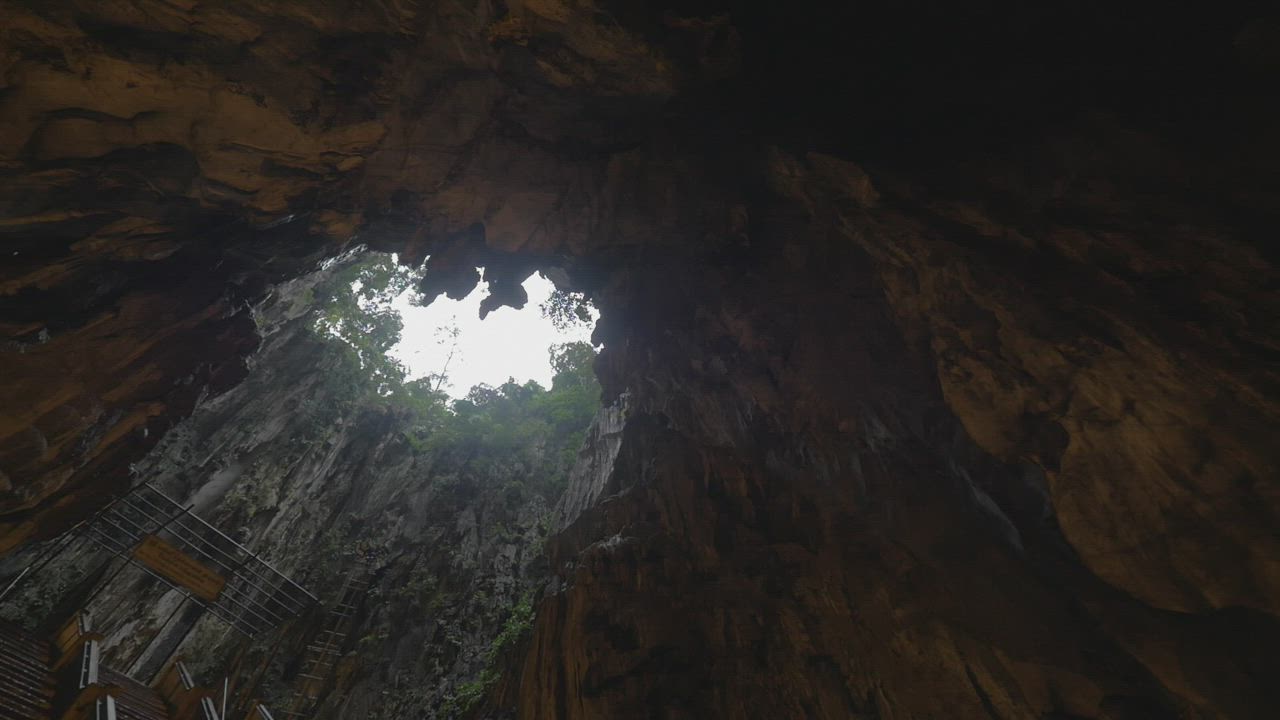 Looking up from a deep cave - Free Stock Video - Mixkit
