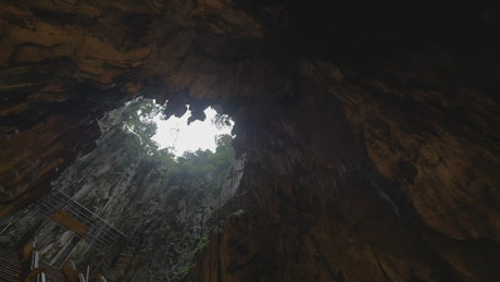 Looking up from a deep cave