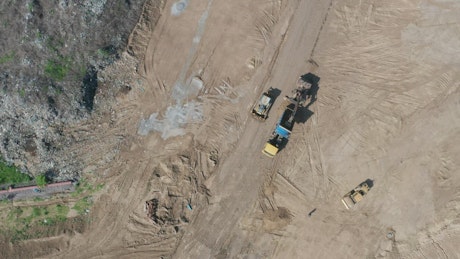 Machines working in a waste site.