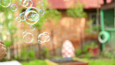 Making bubbles with soap.