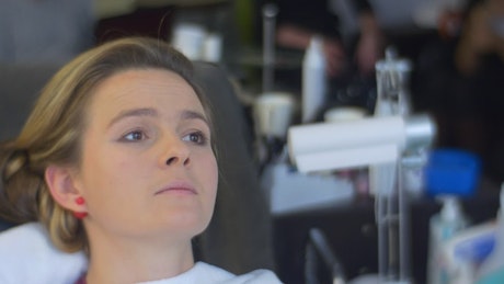 Making up a woman's face in a salon