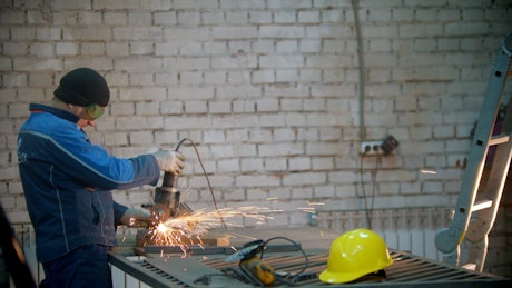 Male welders working in a workshop.