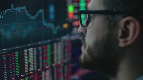 Man analyzing the stock market in real time.