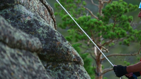 Man climbing a rock