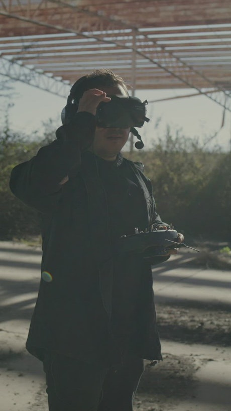 Man controlling a drone with a remote control.