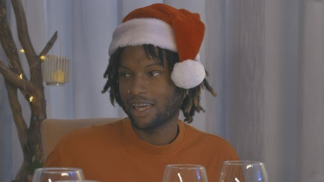 Man drinking wine at christmas dinner.