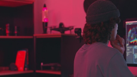 Man editing a video in a studio.