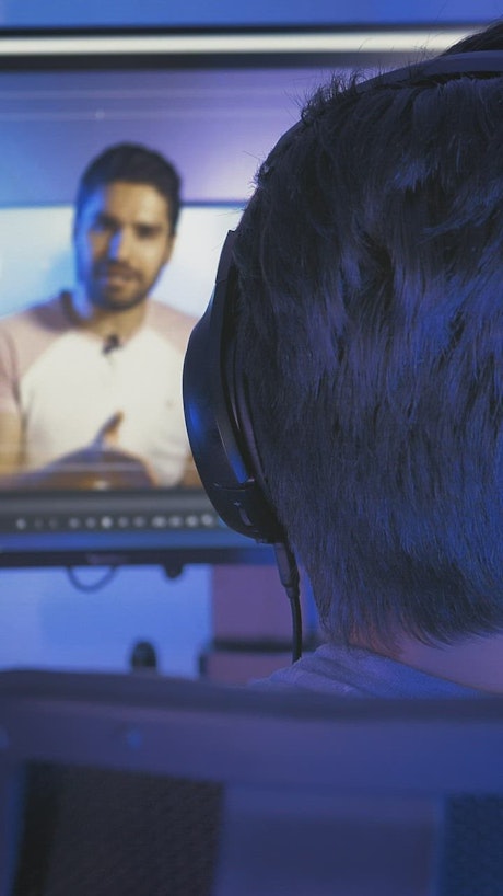 Man editing a video on his computer.