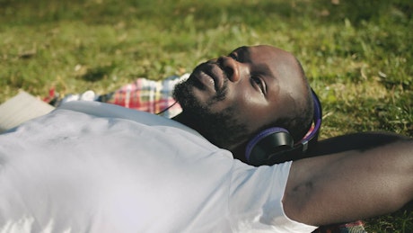 Man enjoying music in the park