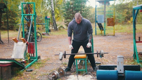 Man exercising in a gym, outdoors