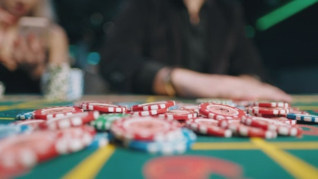Man gambling a few casino chips.