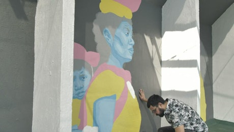 Man painting a mural