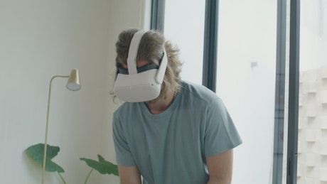 Man playing golf with a virtual reality headset