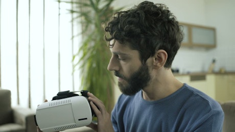 Man puts on a VR headset