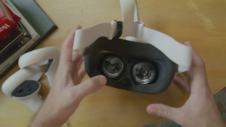 Man putting on virtual reality glasses.