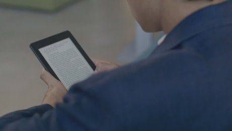 Man reading an electronic book