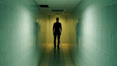 Man walking in a corridor