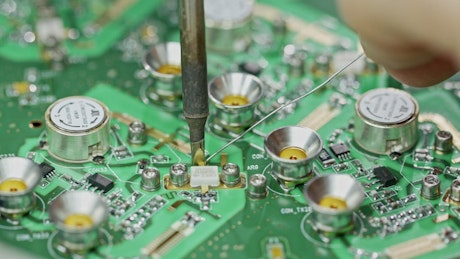 Manual soldering of circuit boards.