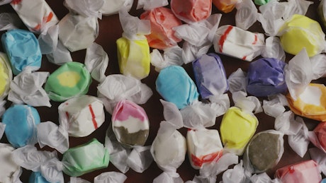 Many wrapped sweets slowly spinning.