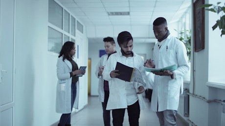 Medical students converse in the hall