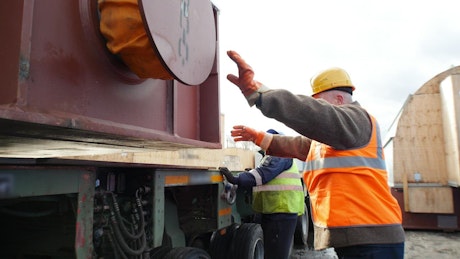 Men working loading a freight truck.