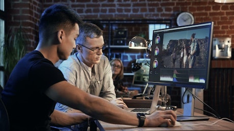 Men working on video editing