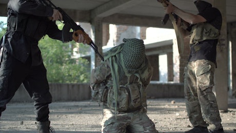 Military men saving hostage from terrorists