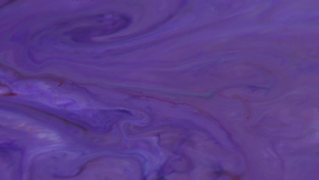 Mix paint in purple tones moving slowly.