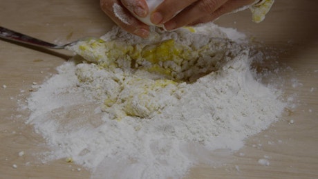 Mixing dough for pasta.