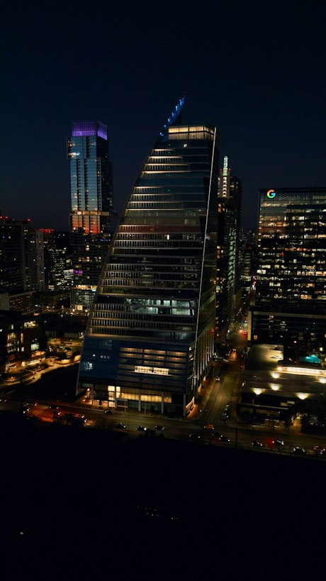 Modern and big building in an aerial shot at night.
