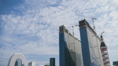 Modern skyscrapers under construction.