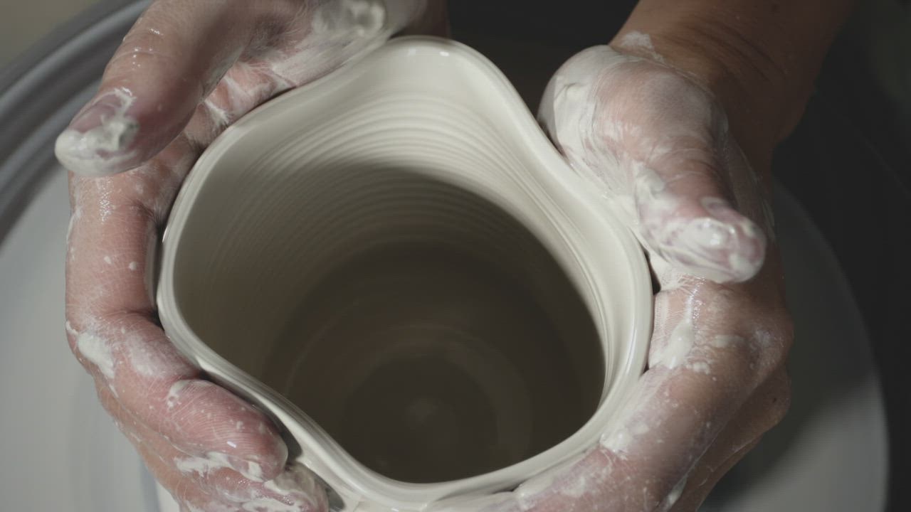 Premium AI Image  a potter molding clay