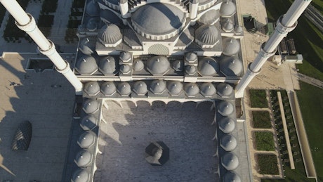 Monumental mosque with many cupolas from above.