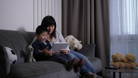 Mother and son using a tablet.